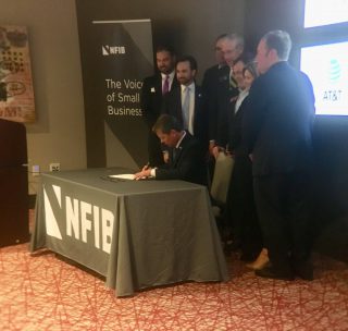 Kemp Signs Staged-Accident Bill at NFIB Small Business Day